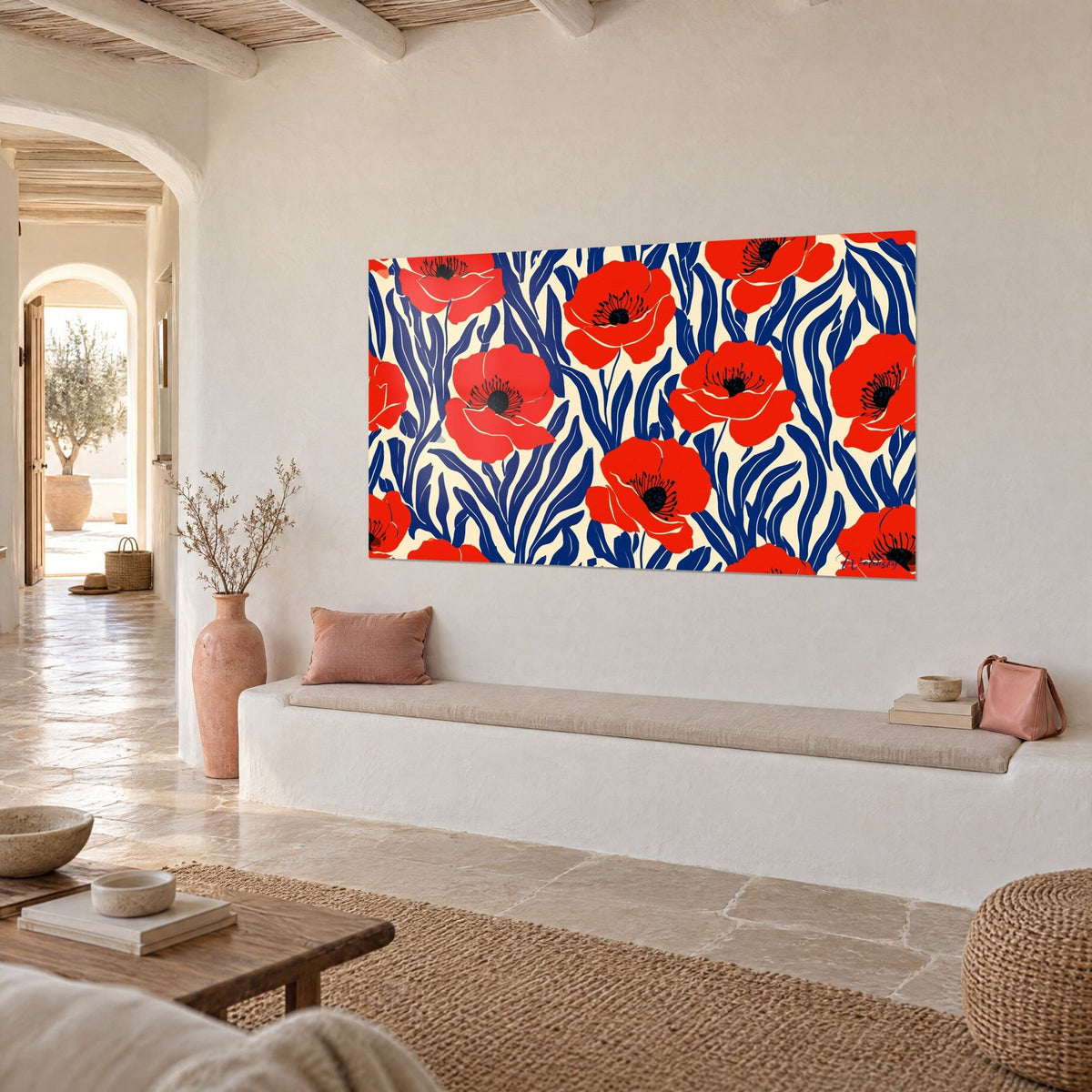 Cuadro de amapolas rojo vivo con corazones negros, tallos índigo ondulados, colgado sobre un banco blanco en un nicho de pared