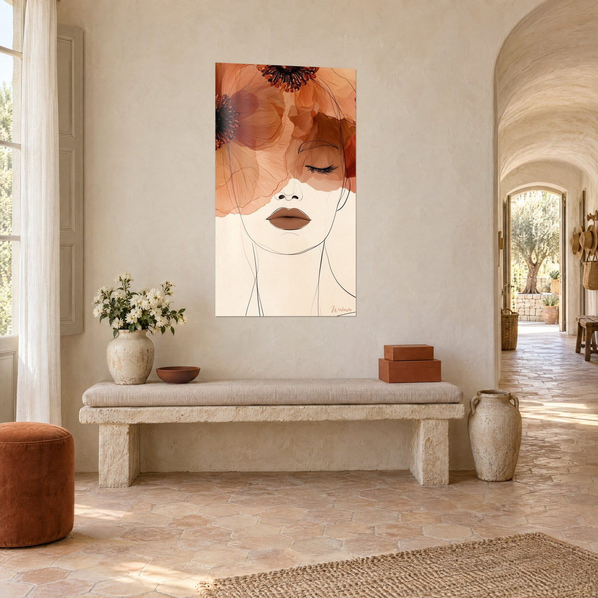 Tableau portrait au trait fin coiffé de larges fleurs terracotta et orangées, lèvres brunes, accroché dans l'entrée voûtée d'un mas provençal