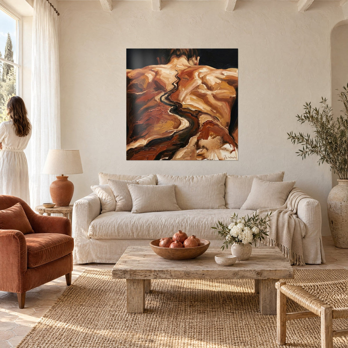 Wall art of a torso in thick ochre and brown impasto, winding black river, a woman in a white dress seen from behind above a sofa in a bright living room