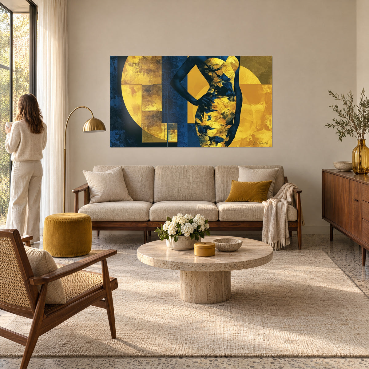 Wall art navy blue female silhouette, hand on hip, golden disc and copper flat tones, above a sofa in a bright living room