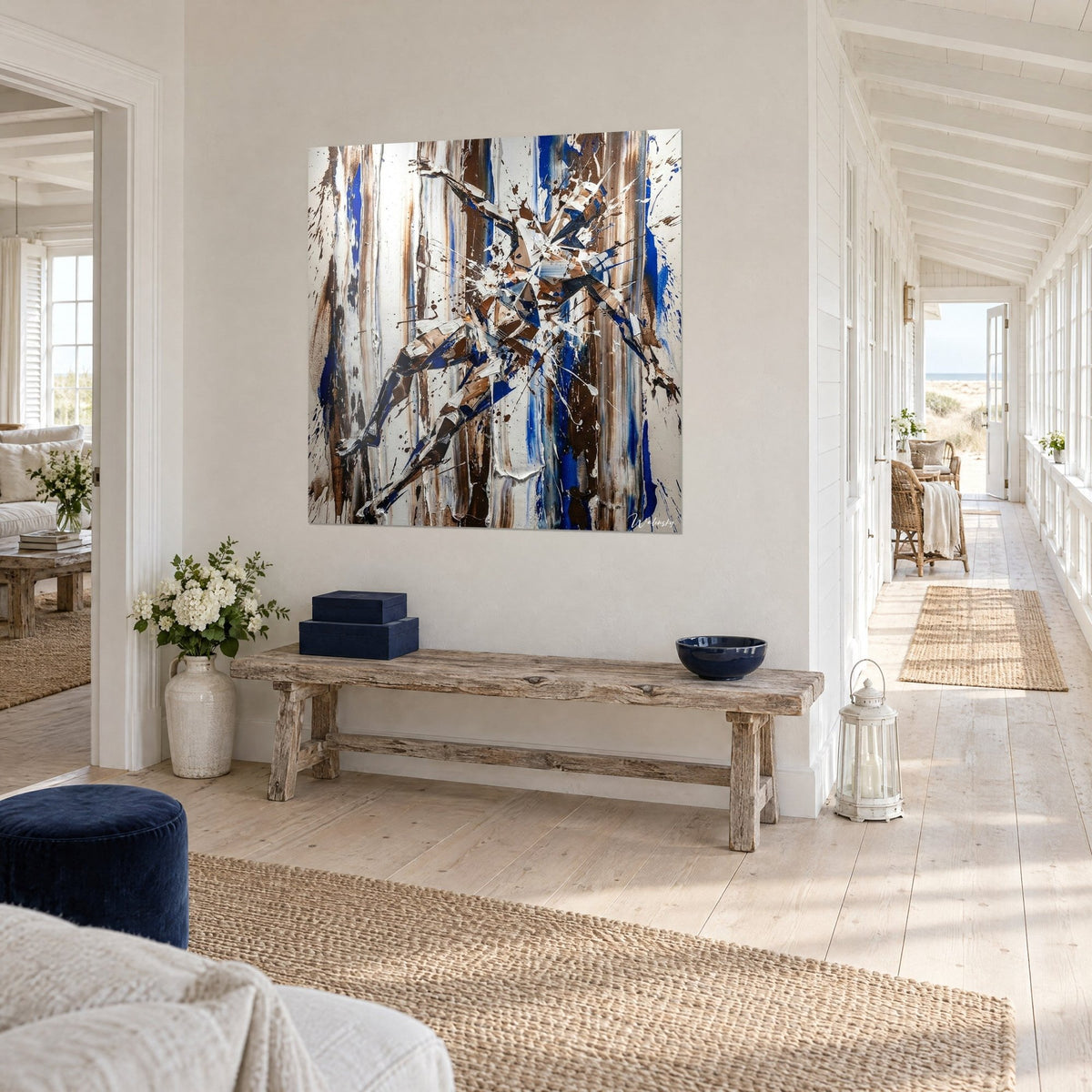 Wall art abstract figure broken into blue and brown facets on a cream background, three-quarter view, house hallway