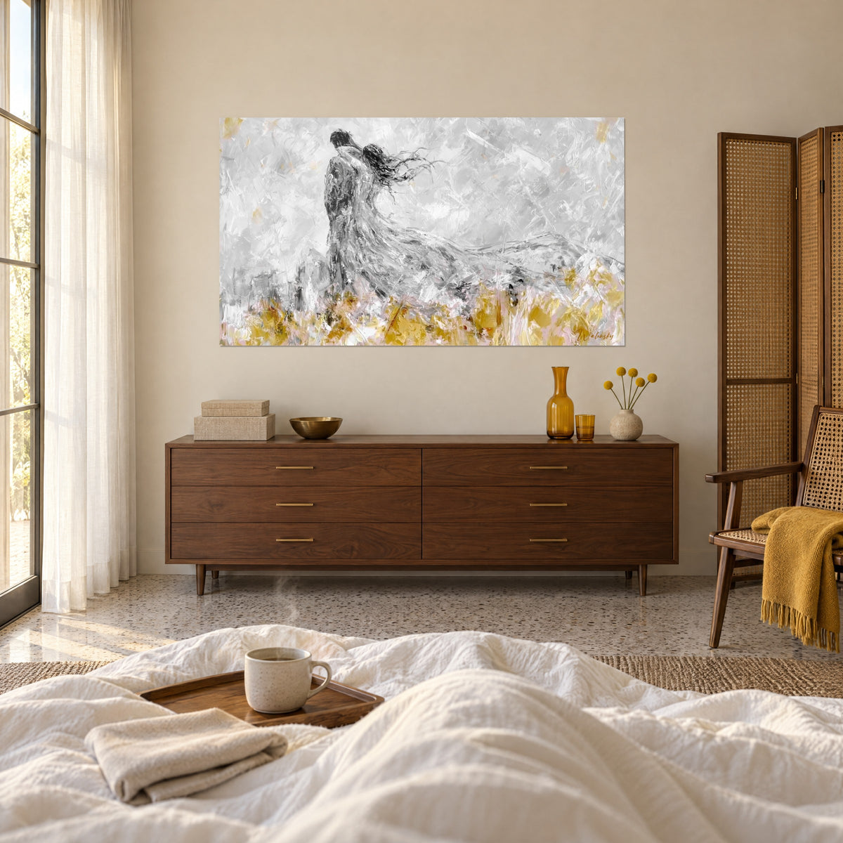 Wall art of two silhouettes united in the wind, flowing hair, ash grey and pale gold, above a bed in a light bedroom
