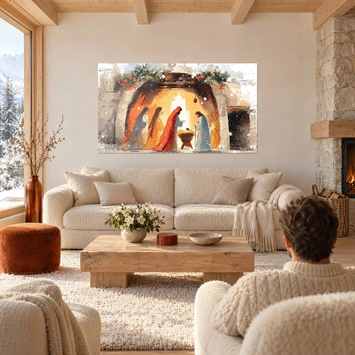 Tableau crèche de Noël sous une voûte ocre, manteau rouge vif et guirlandes de houx, au-dessus d'un canapé dans un salon lumineux