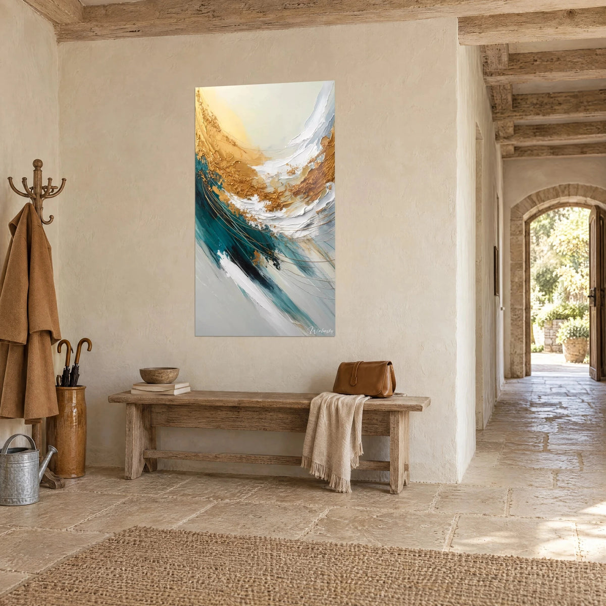 Wall art of an abstract gold leaf spiral, white impasto and petrol blue, on a whitewashed wall, stone-floored entrance