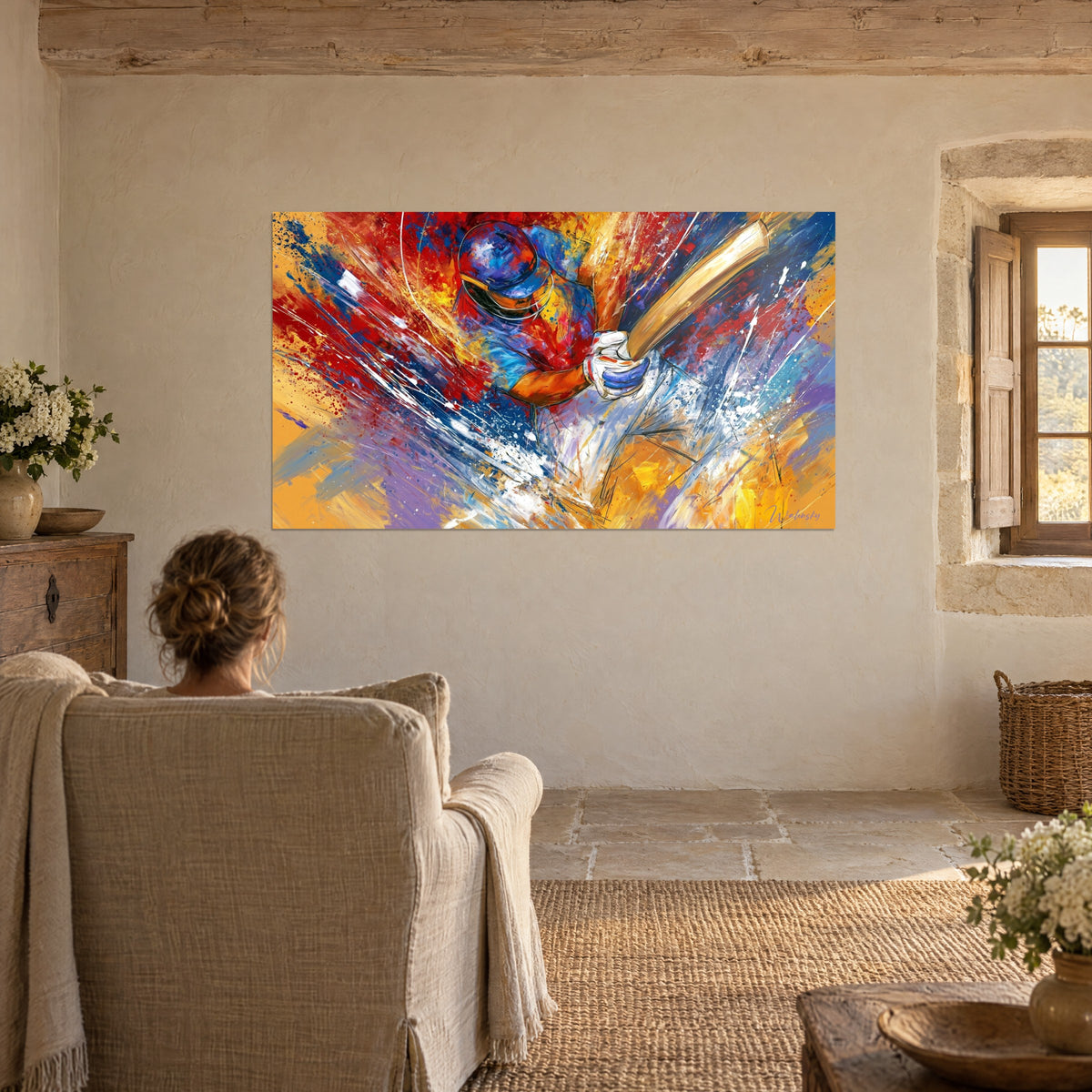 Wall art athlete in helmet with golden bat, swirl of red, violet and ochre, facing a woman seated in a linen armchair