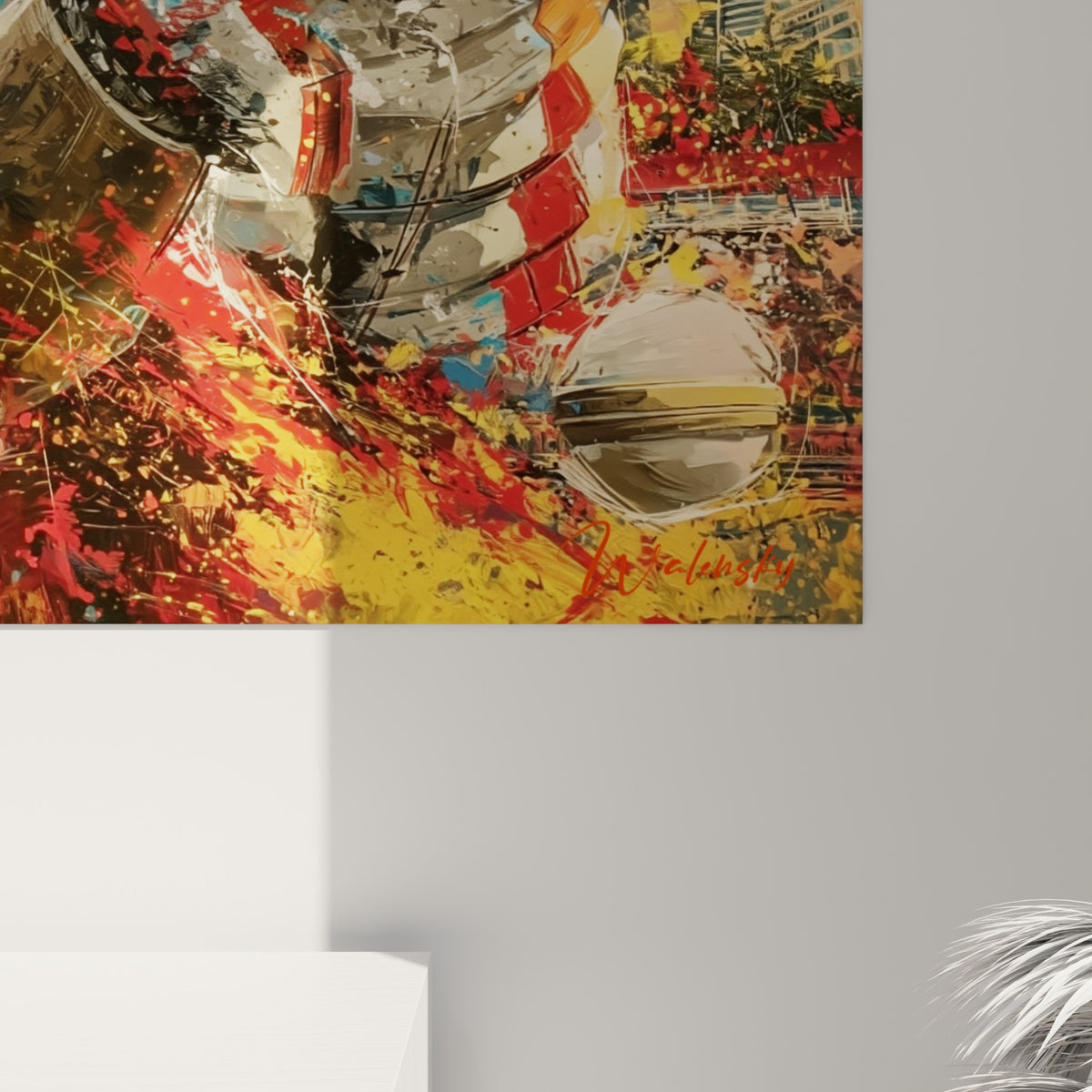 Éclats de peinture rouge, jaune et blanc figurant l'impact de la balle sur la batte, matière texturée visible