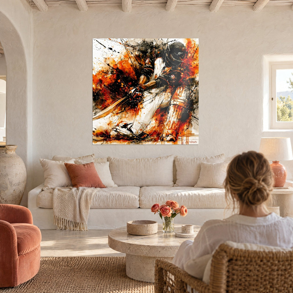 Tableau joueur de cricket casqué en pleine frappe, éclaboussures orange et noir, jambières blanches, au-dessus d'un canapé dans un salon lumineux