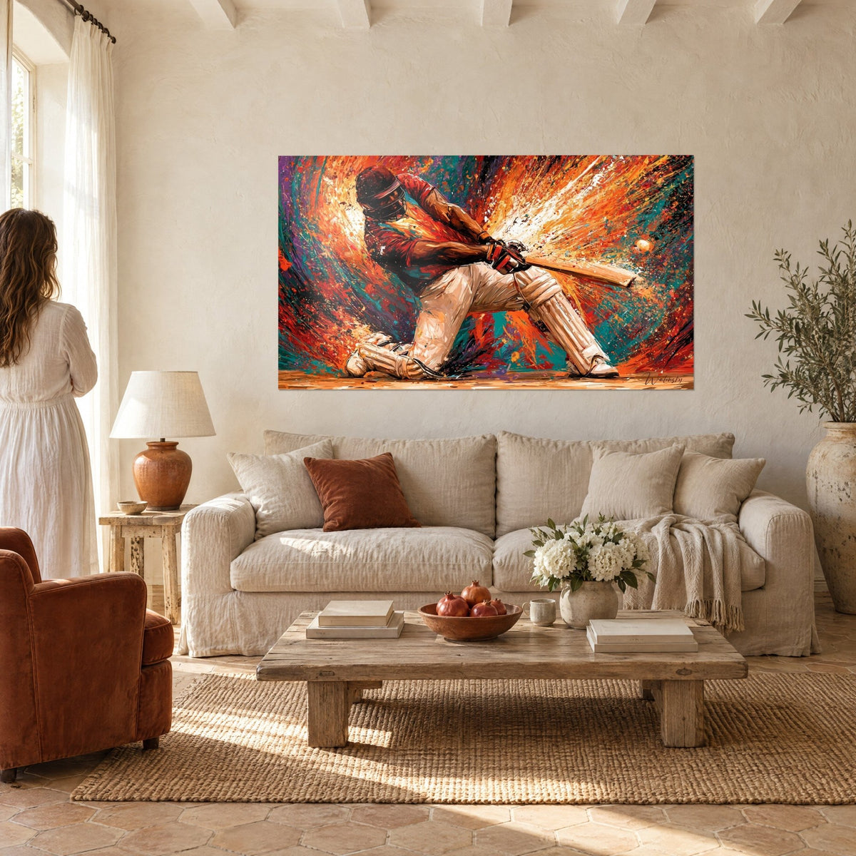 Tableau batteur de cricket au genou fléchi, maillot rouge et fond turquoise éclaté, au-dessus d'un canapé dans un salon lumineux