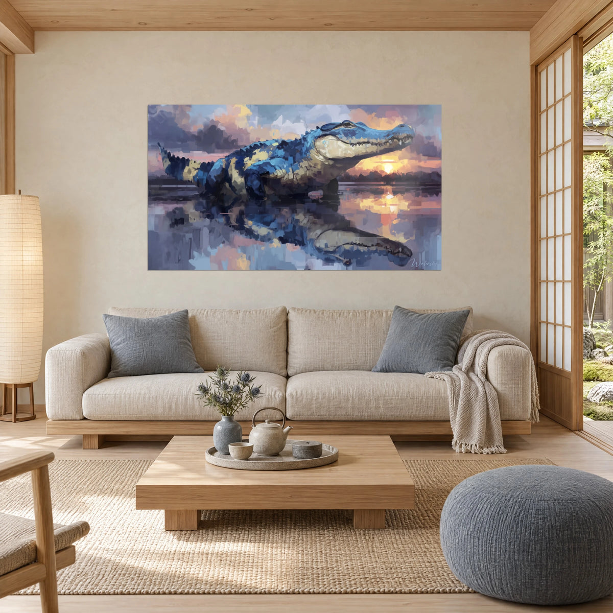 Wall art of a cobalt blue crocodile with sand-colored scales facing the orange sun, reflection in the water, above a sofa in a bright living room