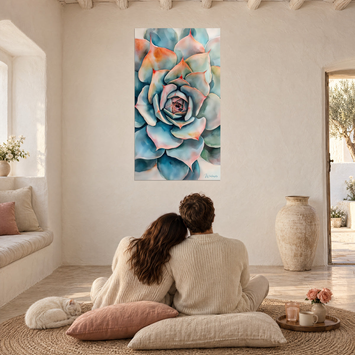 Tableau succulente géante turquoise et corail, couple de dos assis sur des coussins roses, chat calme, pièce blanche