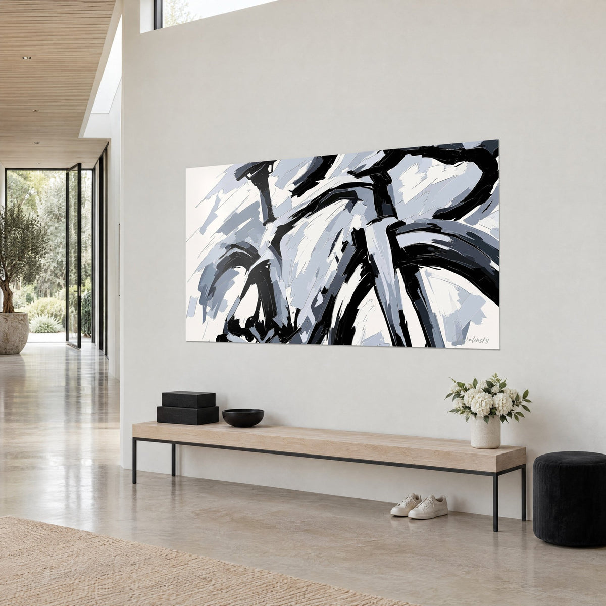 Wall art bicycle frame in black ink lines and blue-grey flat areas, seen from an angle, beige wall, light wood bench