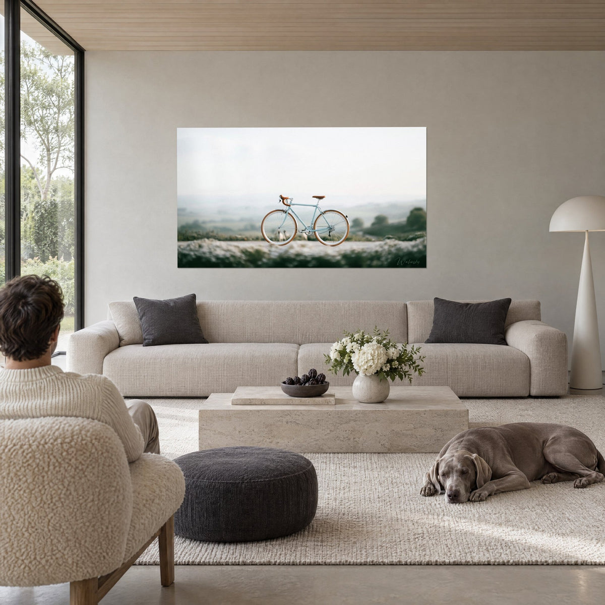 Wall art pastel blue road bike with cognac saddles on a flowering low wall, soft mist, above a sofa in a bright living room