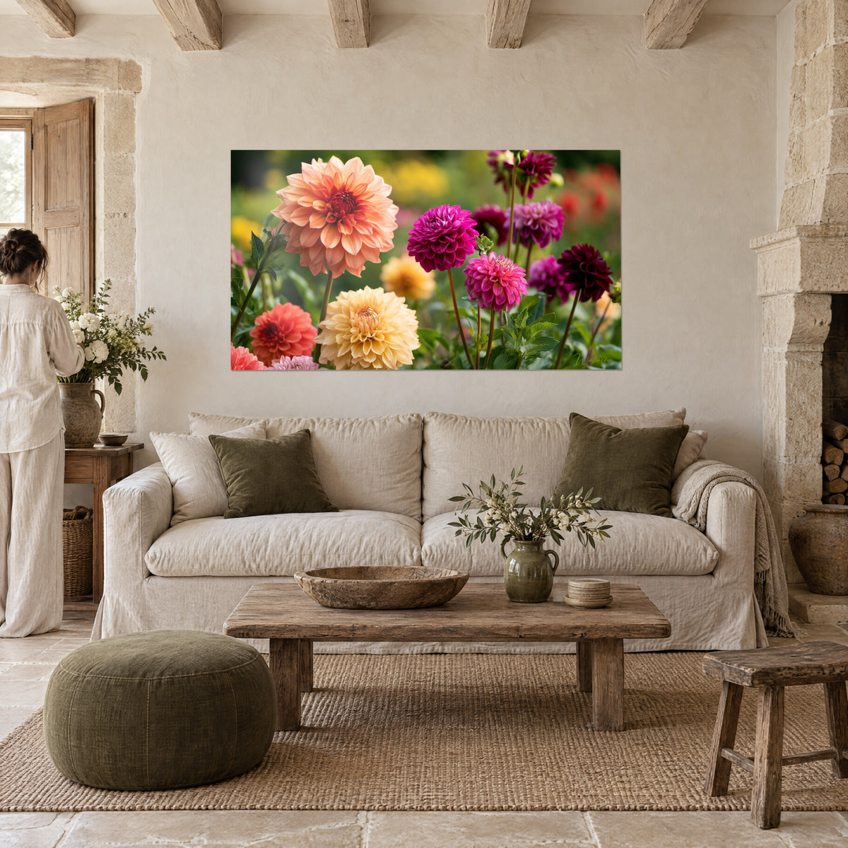 Wall art of peach and magenta dahlias in full bloom, coral hearts and golden petals, above a sofa in a bright living room