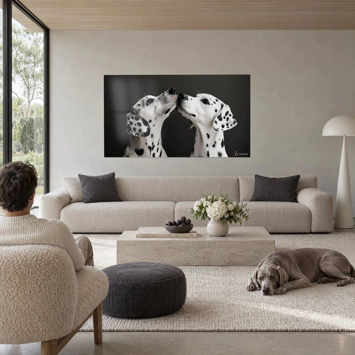 Wall art two Dalmatians muzzle to muzzle, white coat dotted with black spots on an anthracite background, above a sofa in a bright living room
