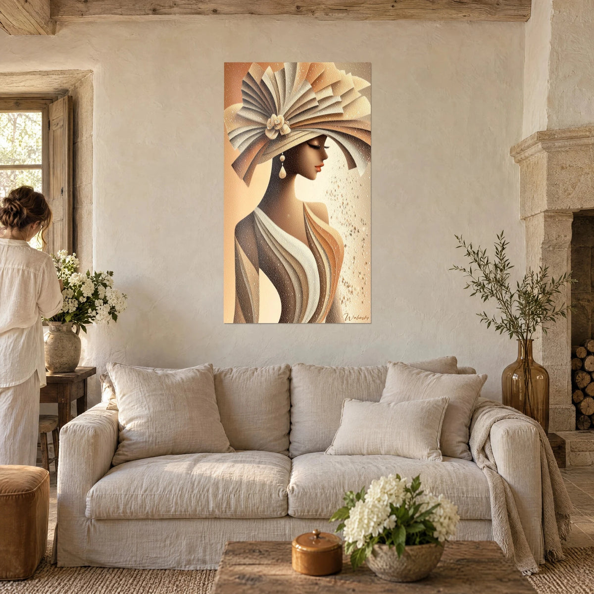 Wall art woman in a beige and caramel pleated hat, profile with eyes closed, coral lips, above a sofa in a bright living room