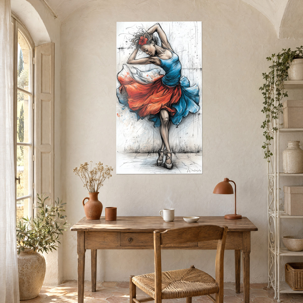 Wall art danced portrait with ink-line features, cobalt blue top and flowing orange-red skirt, above a light wood desk