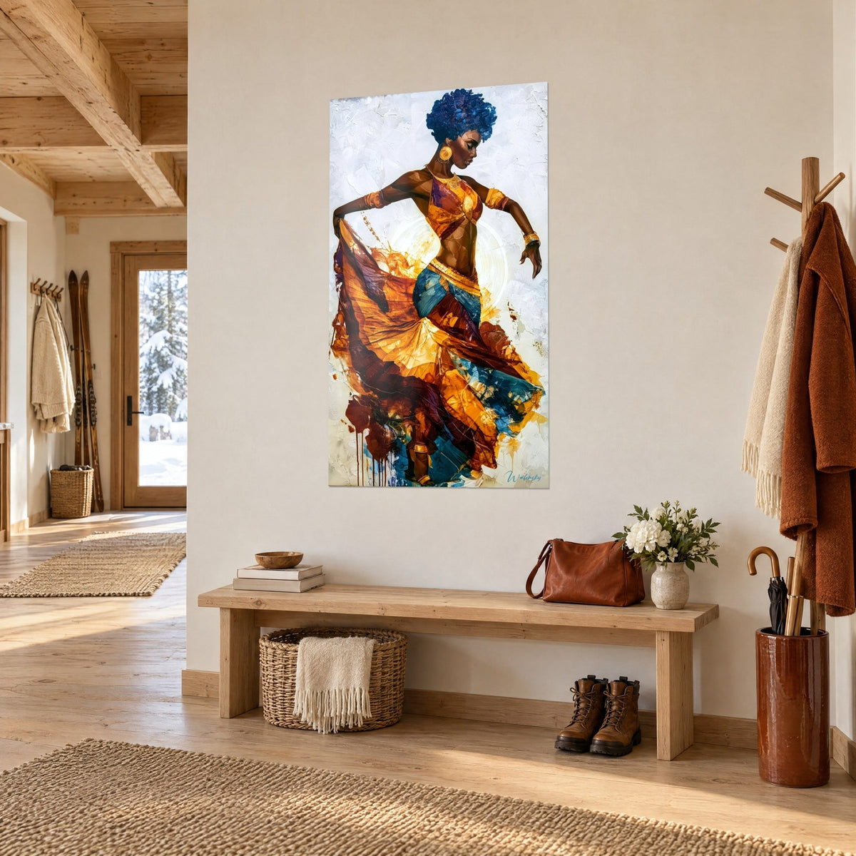 Tableau femme dansante aux boucles indigo, bustier orange et jupe ocre bleu pétrole, accrochée sur un mur crème d'entrée de chalet