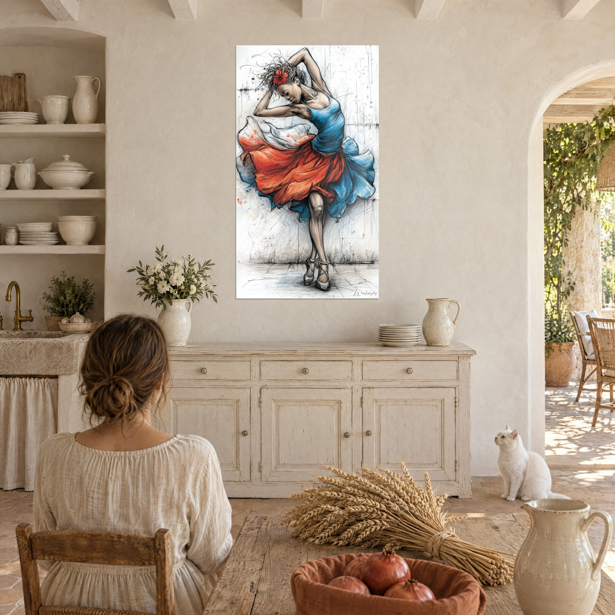 Wall art dancer silhouette in black sketch, vivid orange and ultramarine blue petticoat, above a white sideboard and a white cat