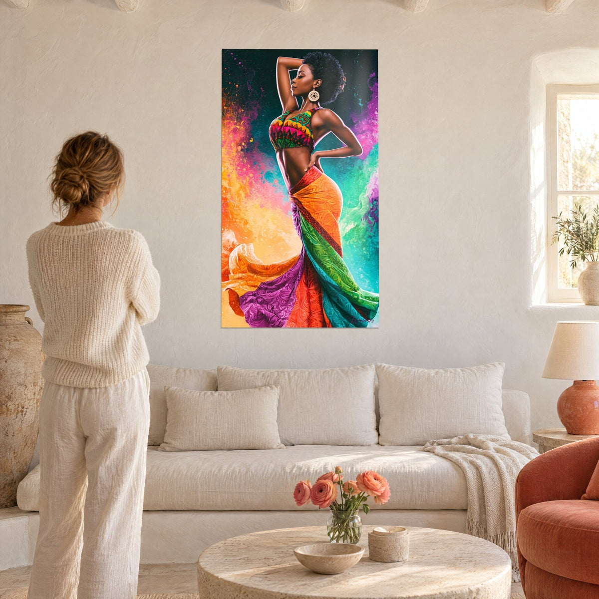 Tableau danseuse africaine au crop top à motifs, jupe orange et violette, fond turquoise, au-dessus d'un canapé dans un salon lumineux