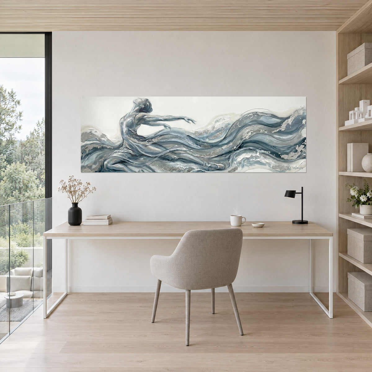 Wall art dancer in motion, streams of steel blue and silver-grey paint on a white ground, hung above a light wood desk