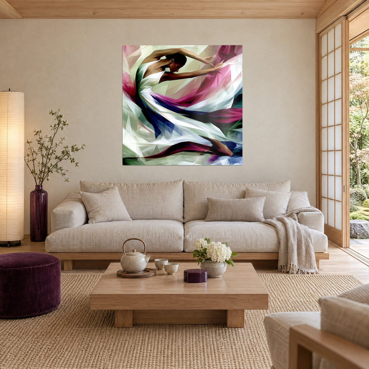 Cuadro bailarina con vestido blanco, brazos en alto, velos magenta y azul marino, encima de un sofá en un salón luminoso