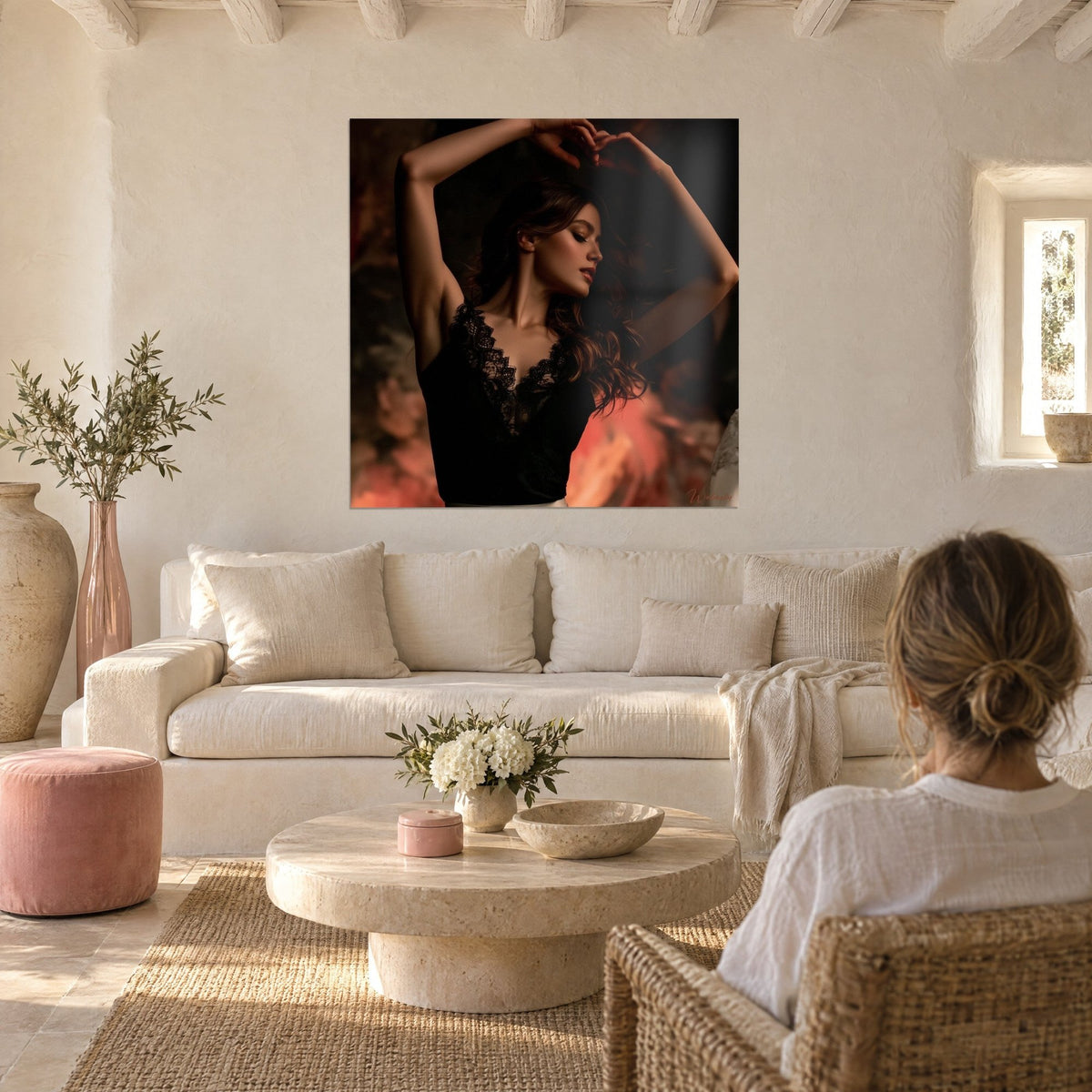 Wall art dancer with arms raised, black lace blouse, coral and brown background, above a sofa in a bright living room