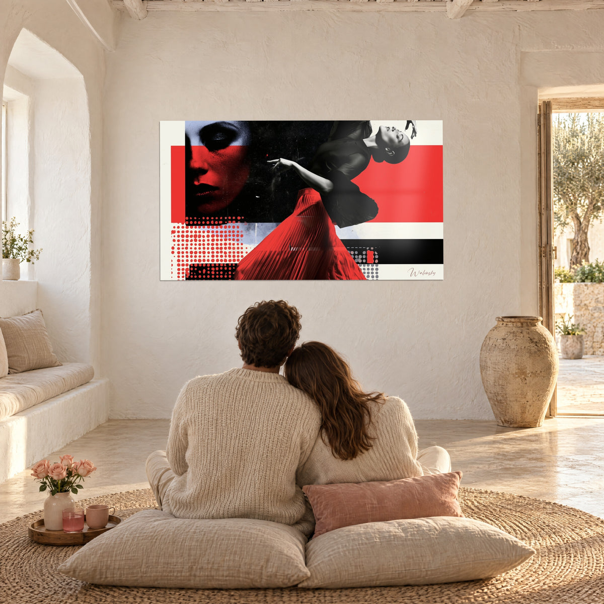 Wall art female figure arched back, red pleated skirt, black torso on ivory background, facing a couple seated on beige cushions