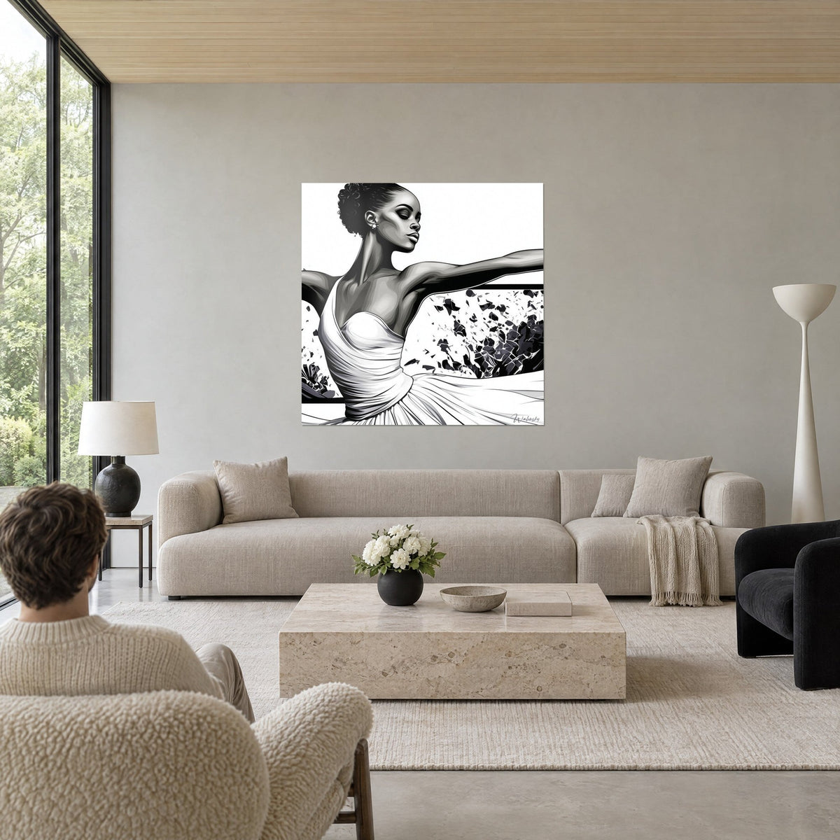Tableau danseuse en robe blanche drapée, bras tendu, éclats noirs sur fond blanc, au-dessus d'un canapé dans un salon lumineux