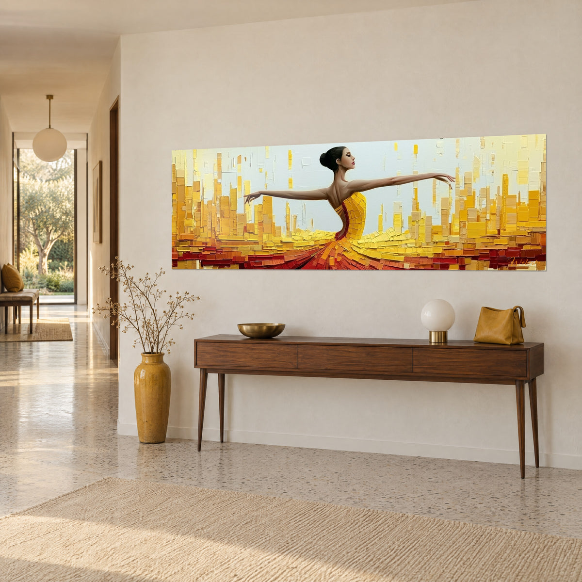 Πίνακας μπαλαρίνα με καφέ κότσο, φούστα από κίτρινες και κόκκινες πινελιές σε φόντο χρυσών ουρανοξυστών, πάνω από ξύλινη κονσόλα