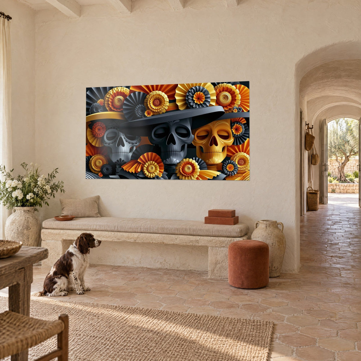 Wall art grey and gold calaveras wearing hats, ochre and charcoal rosettes, seated spaniel, cream wall of a Provençal farmhouse
