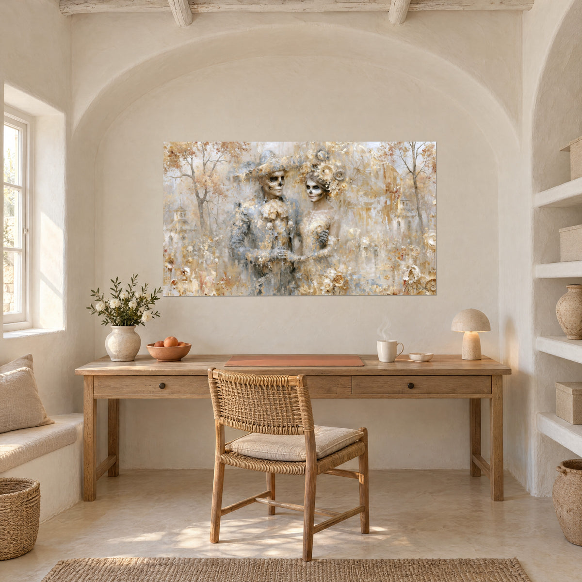 Wall art duo of calaveras in gold and silver garments, beige and ochre autumn forest, above a light wood desk