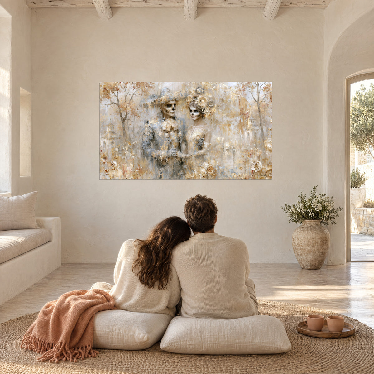 Wall art skeleton lovers in honey and blue-grey tones, ivory flower petals, couple seen from behind seated on white cushions