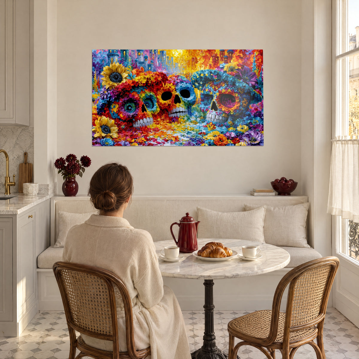 Wall art Day of the Dead with skulls adorned with sunny yellow and cobalt blue flowers, young woman seen from behind at the breakfast table