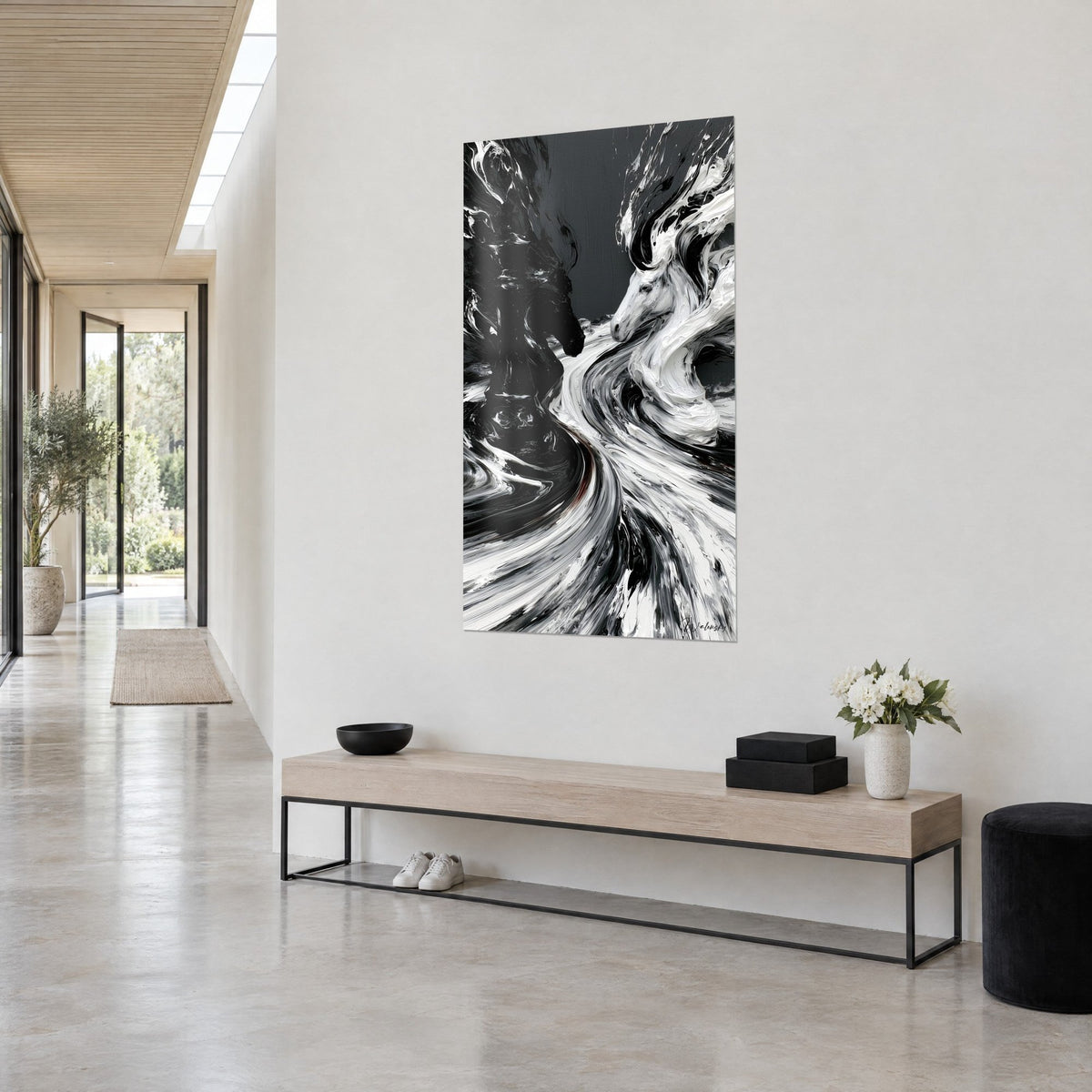 Wall art duel of warhorses in thick black and white paint, swirling manes on grey background, hallway and light wood bench