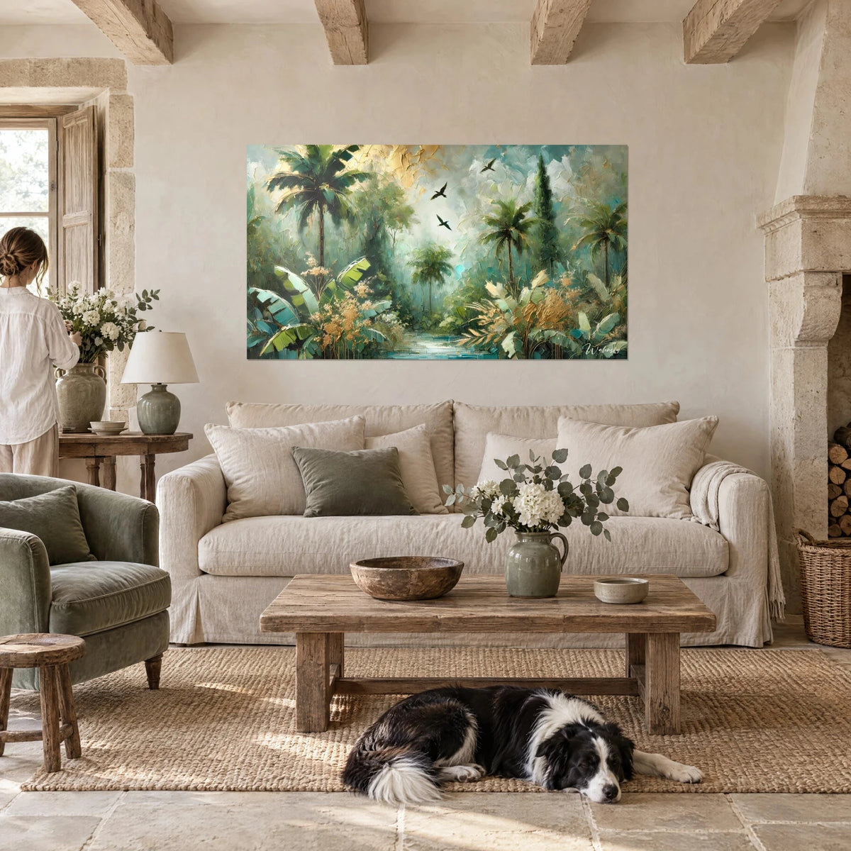 Wall art of a tropical jungle with green palm trees and golden foliage, two black birds in flight above a sofa in a bright living room