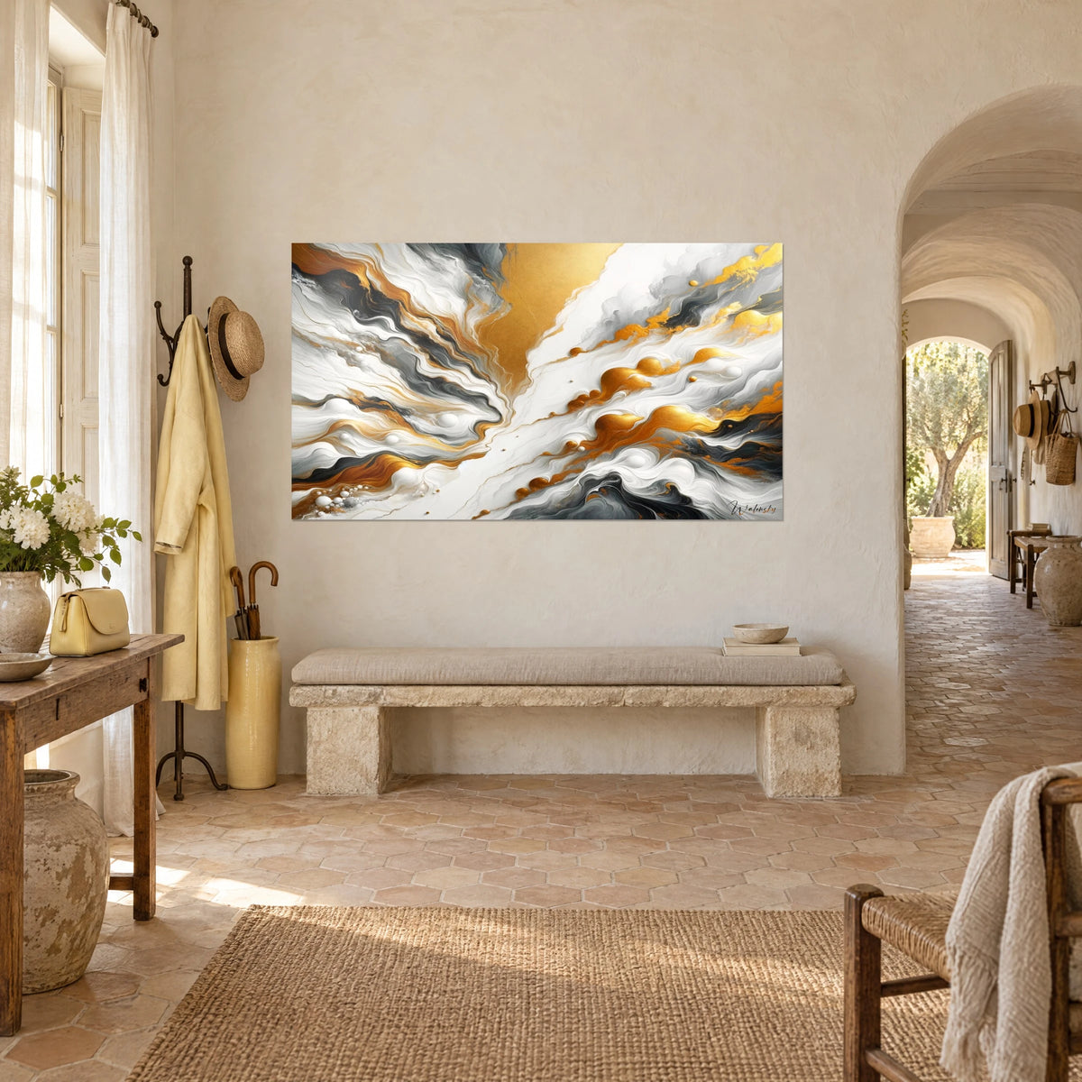 Wall art with liquid gold pours on an ivory background, grey V-shaped swirls, hung in the entrance of a Provençal farmhouse