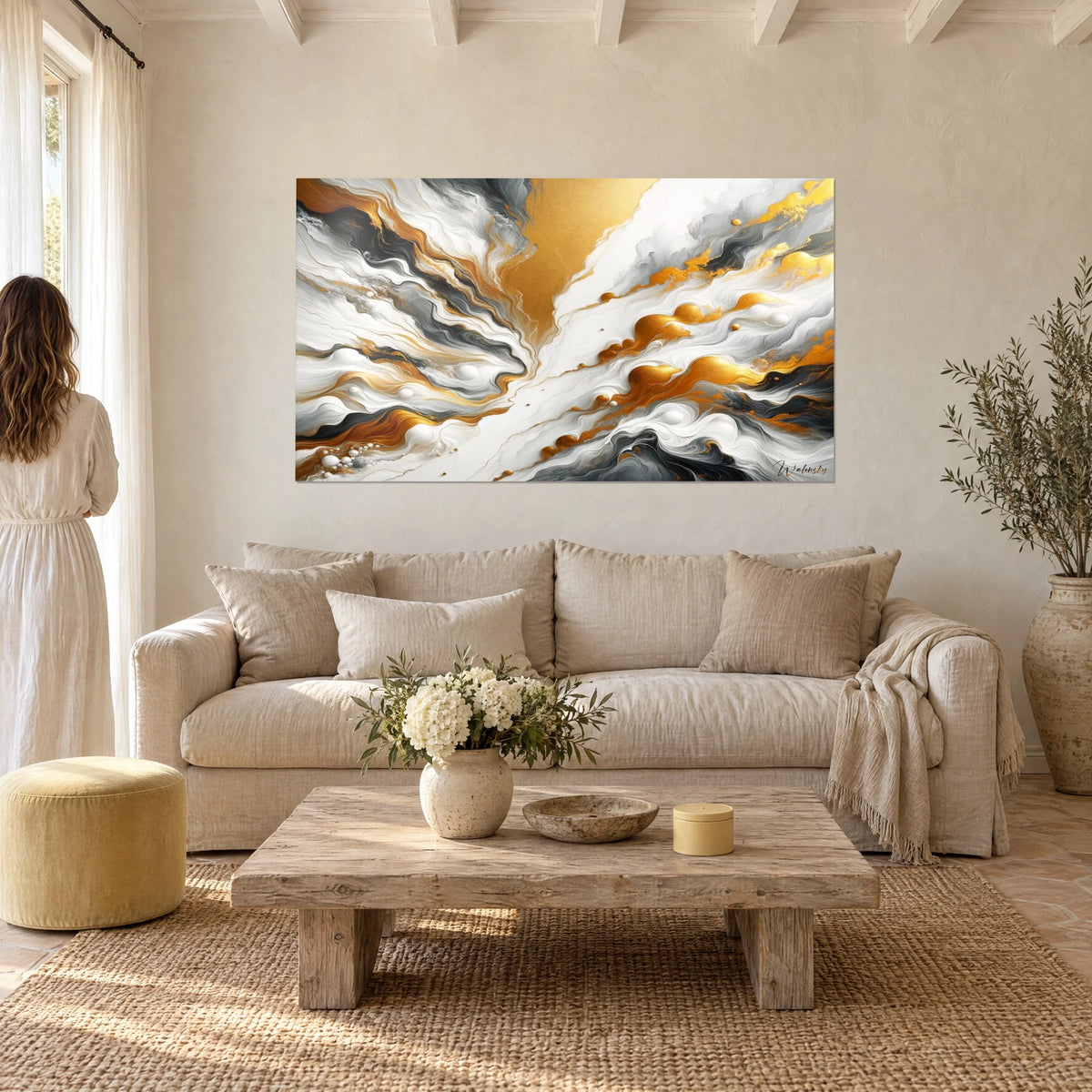 Wall art with fluid marbling in pearly white and shiny gold, black veins, above a sofa in a bright living room