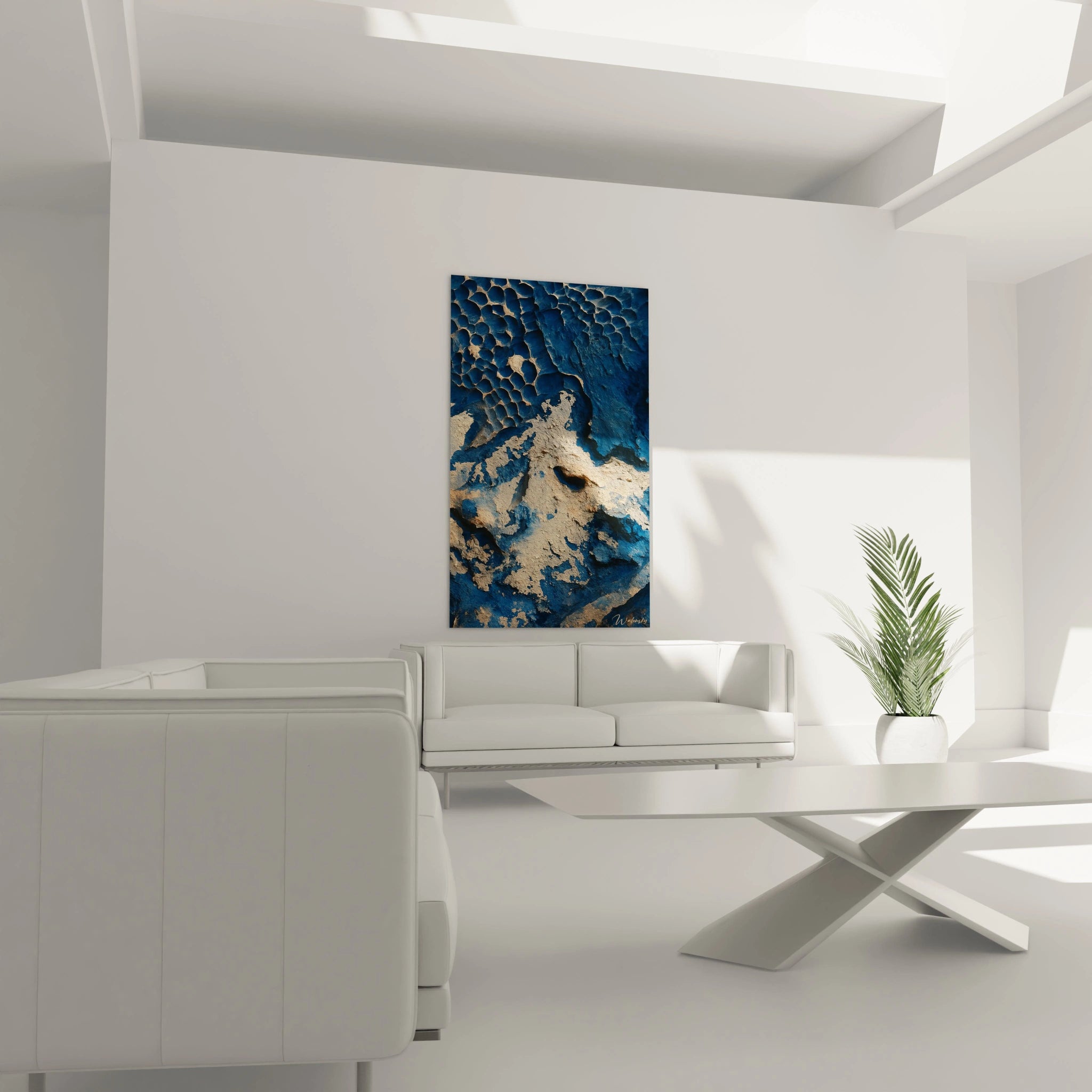 Un tableau vue aérienne aux tons bleu profond et beige sable, montrant des structures en nid d'abeilles et des surfaces érodées. Les textures rugueuses et les reliefs prononcés créent une impression de profondeur géologique, comme un territoire inexploré observé depuis les airs.
