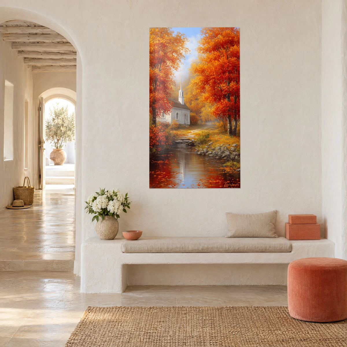 Wall art slender steeple and white facade beneath red and amber foliage, stream in the foreground, living room with whitewashed walls