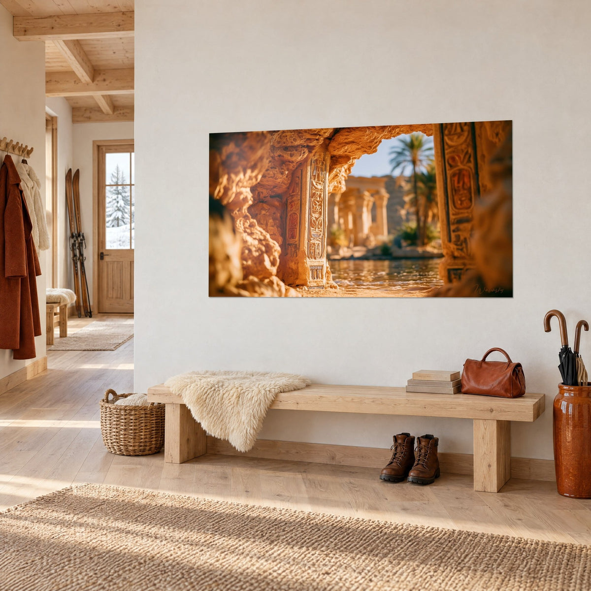 Wall art carved stone threshold with rust-toned hieroglyphs, green palm tree in the distance, above a chalet entryway bench