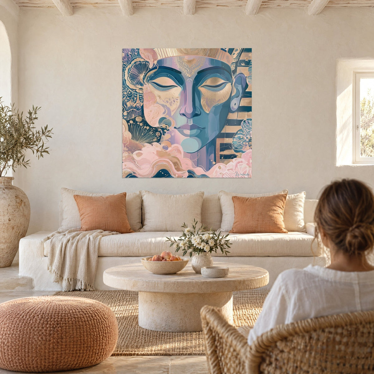 Wall art serene pharaoh face with closed eyelids, deep blue and gold, above a sofa in a bright living room