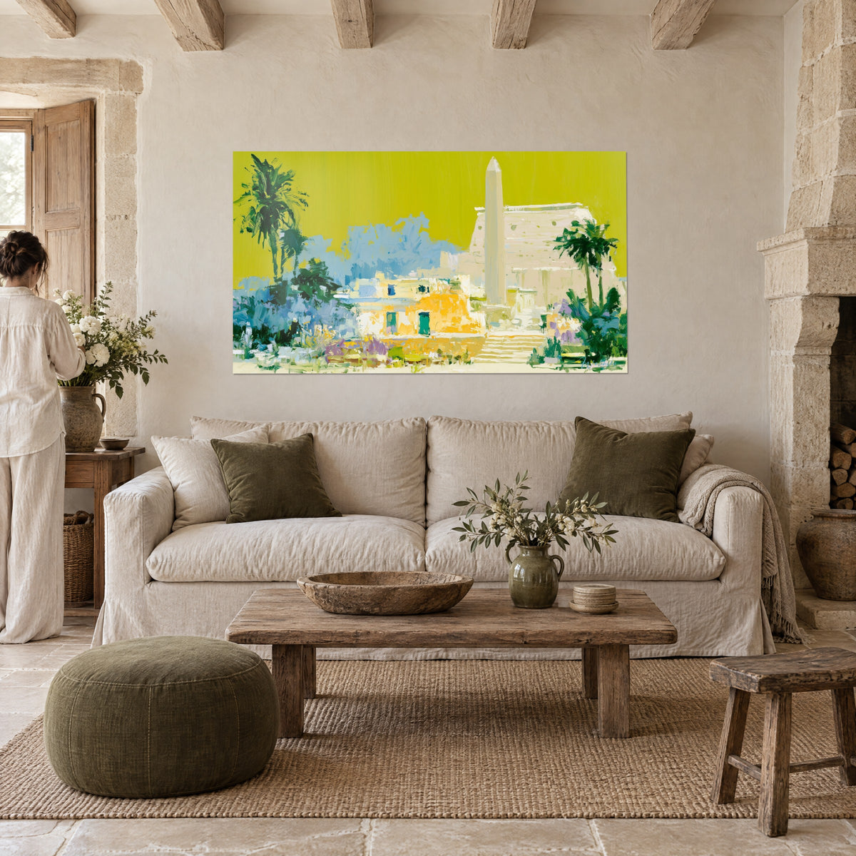 Wall art of a pale obelisk rising against an acid yellow sky, green palm trees and mauve flowers, above a sofa in a bright living room