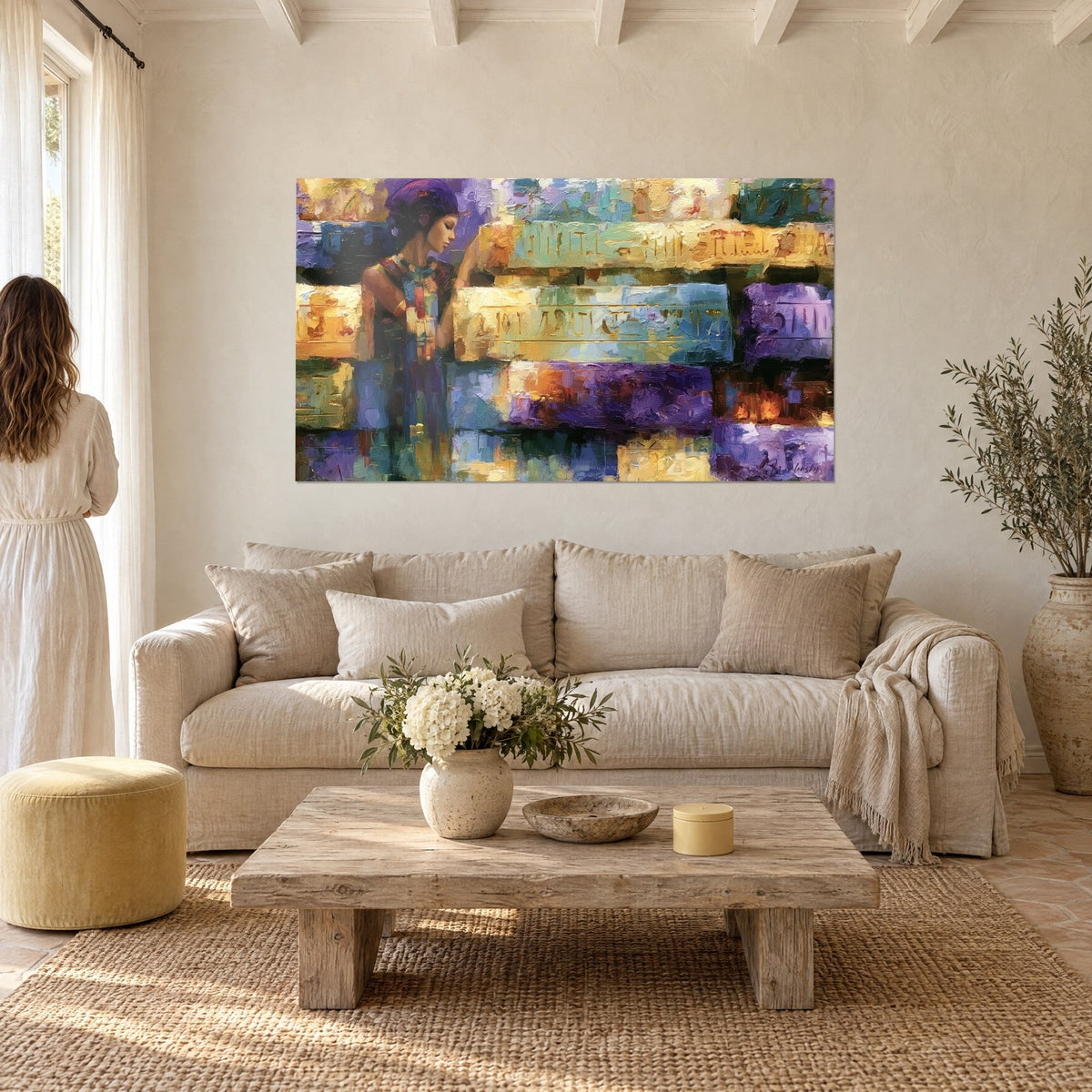 Wall art Egyptian queen in a purple turban in profile, beside gilded and turquoise carved blocks, above a sofa in a bright living room