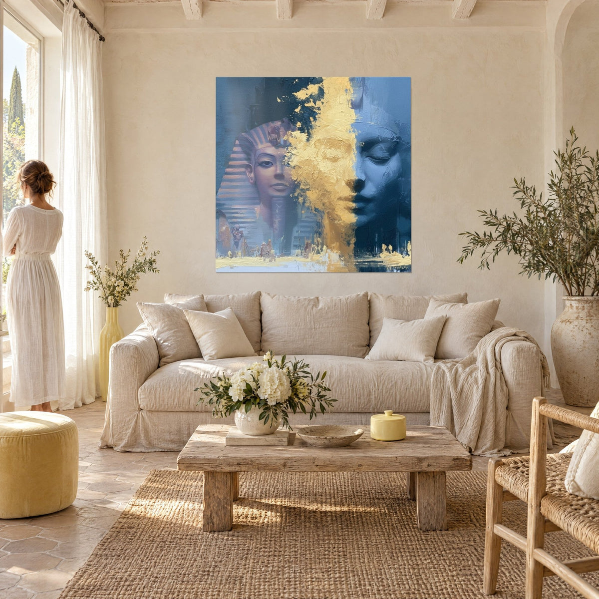 Wall art pharaoh in striped nemes, face split between steel blue and thick gold, above a sofa in a bright living room
