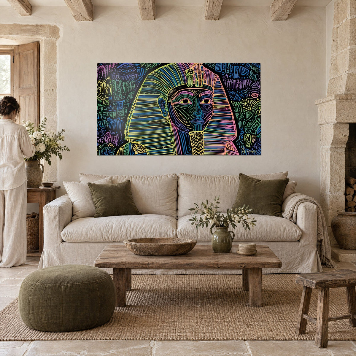Wall art pharaoh in yellow and neon blue striped nemes on black background, sacred cobra on the forehead, above a sofa in a bright living room