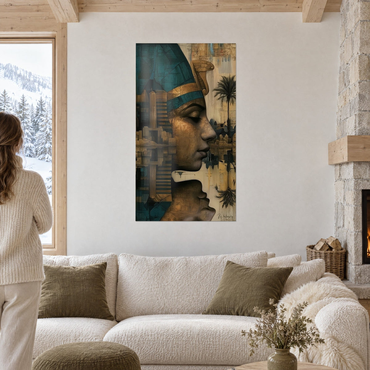 Wall art of a pharaoh in gold profile with a turquoise headdress, black palm tree, above a sofa in a bright living room