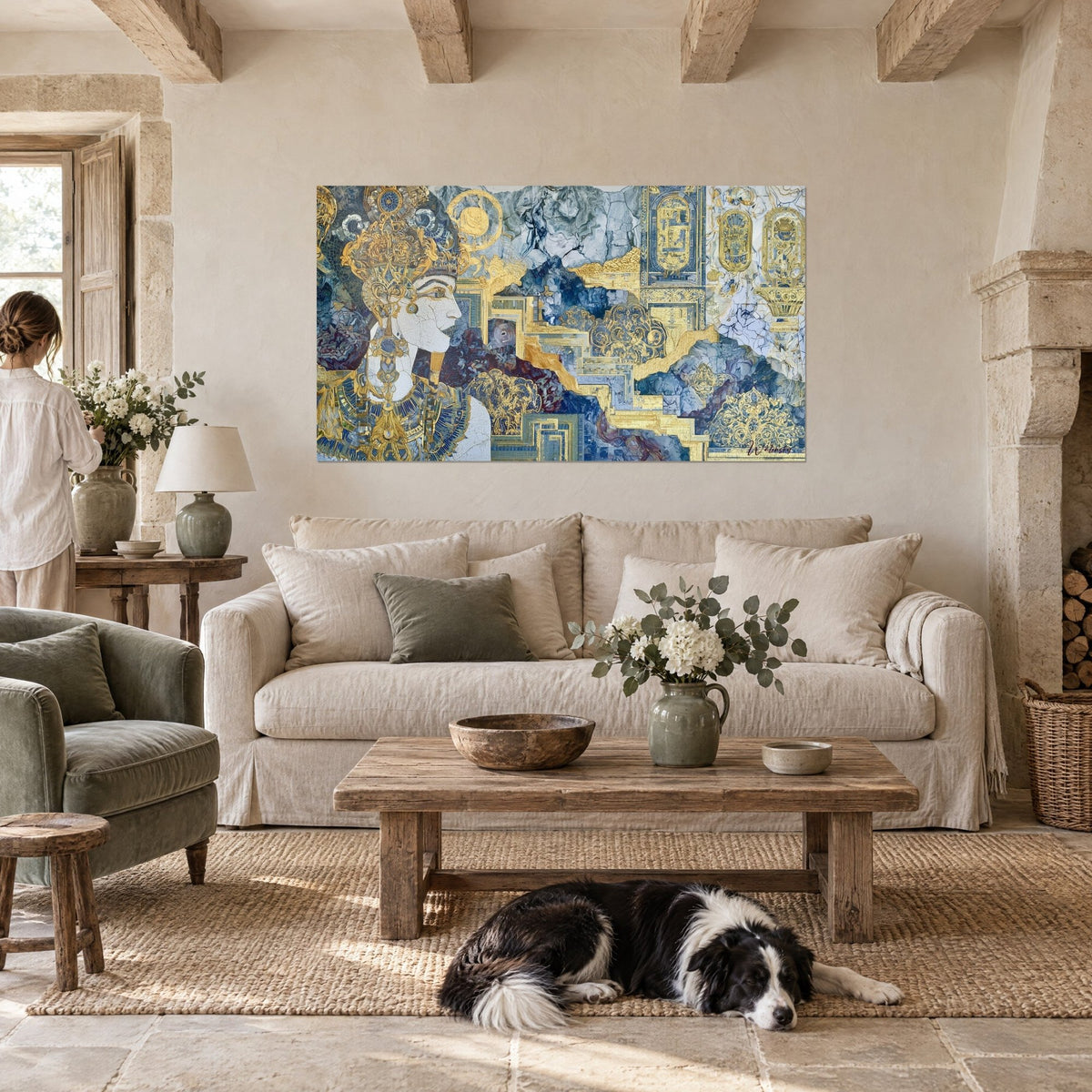 Wall art of an Egyptian queen in profile wearing a chased gold diadem, white profile and blue cartouches, a collie lying down, above a sofa in a bright living room