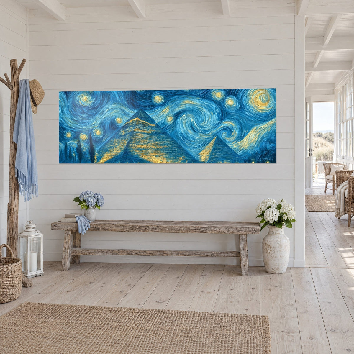 Wall art panoramic Egyptian starry night, cobalt blue spirals and golden yellow highlights, white wall beside a rustic bench