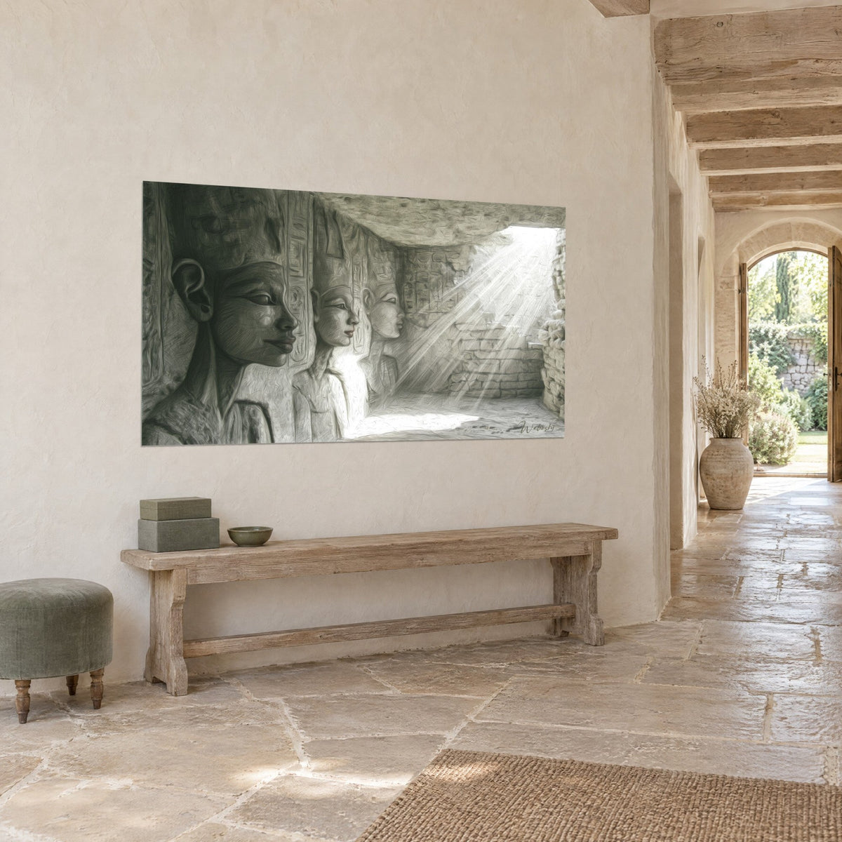 Wall art with Egyptian pharaoh effigies in grey stone and ivory, hieroglyphs and a shaft of sunlight, hung at three-quarter view in a stone hallway