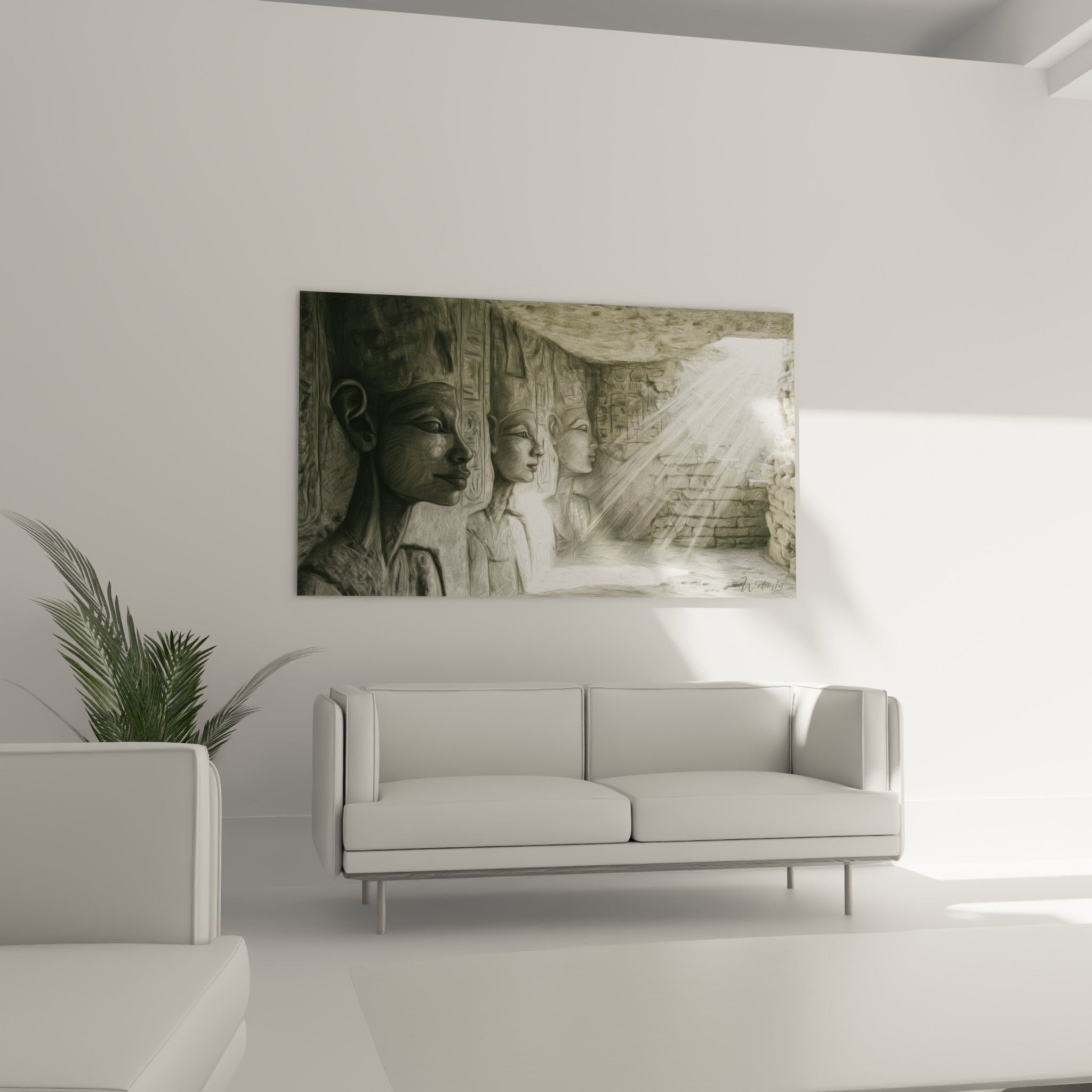 Silhouettes égyptiennes anthracite et blanches au-dessus d'un canapé dans un salon lumineux